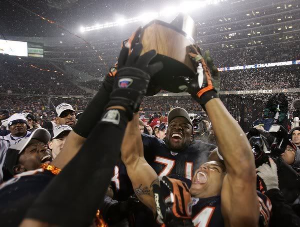 Idonije #71 and Brendon Ayanbadejo (R) #94 of the Chicago Bears celebrate with the George S. Hallas trophy after the Bears 39-14 Pictures, Images and Photos