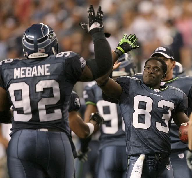 Deion Branch #83 of the Seattle Seahawks celebrates with Brandon Mebane #92 after the Seahawks scored a safety against the Oakland Raiders in a preseason game at Qwest Field August 30, 2007 in Seattle Pictures, Images and Photos