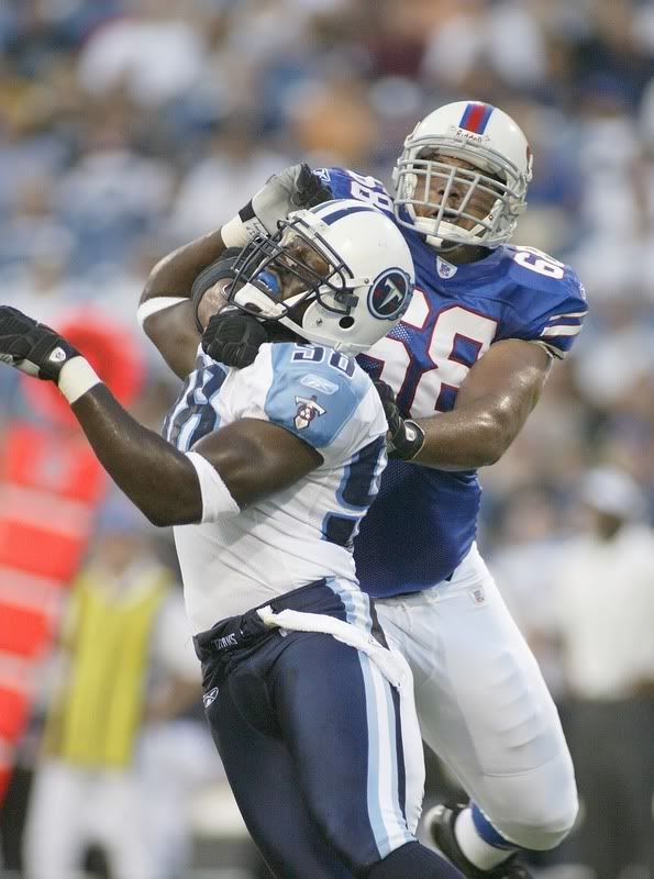 Antwan Odom #98 of the Tennessee Titans works to get around Langston Walker #68 of the Buffalo Bills at a preseason game at Ralph Wilson Stadium August 24, 2007 Pictures, Images and Photos