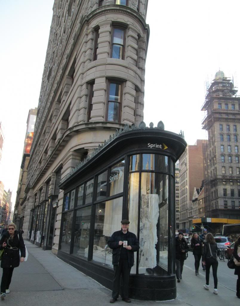 Standing in front of the Flatiron building. Standing in front of the Flatiron building.